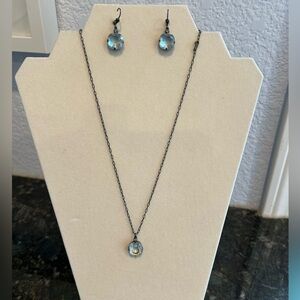 Blue necklace and earring set. Blue colored gems with tiny diamond like stones